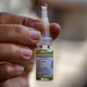 A health worker shows a vial of the oral polio vaccine, used as part of a mass vaccination campaign in the Philippines in 2019.